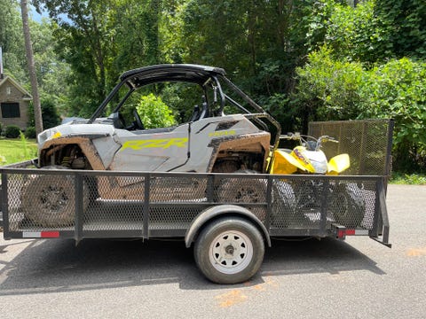 polaris rzr trail and honda 250x atv in a utility trailer