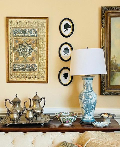 a design by may hussein, which includes islamic artwork that features a verse from the quran