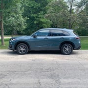 honda hr v parked next to a park
