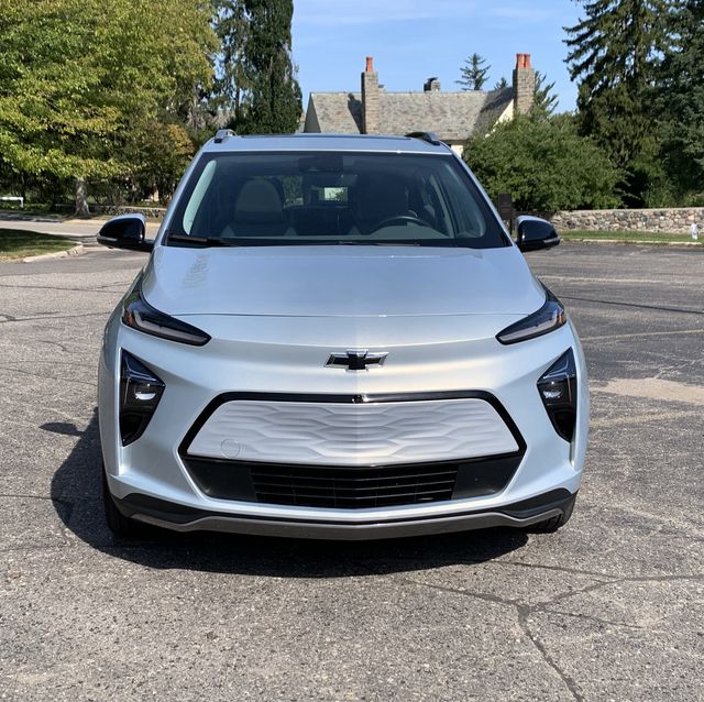 silver chevy bolt euv in parking lot in front of a church