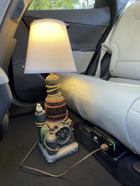 kia ev6 with lamp plugged into back seat outlet