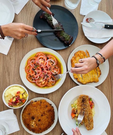 A table filled with food from Jose Enrique's restaurant