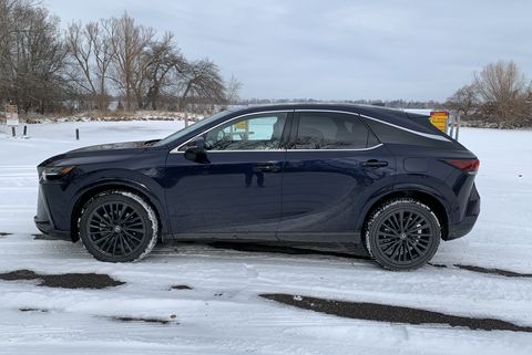 lexus rx 350h from the side next to a snowy boat launch