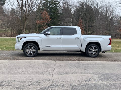 toyota tundra from the side in front of a park