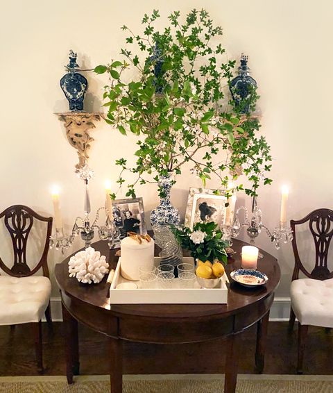 aerin lauder's bar table featuring pieces from her home decor line aerin