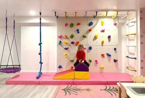 A rock climbing wall and monkey bars by Smart D2 Playrooms in Parker Bowie Larson's home a rock climbing wall and monkey bars by smart d2 playrooms in parker bowie larson's home