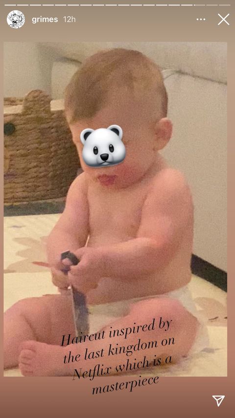 A photo of a baby Grimes and Elon, whose face is covered with a bear emoji, "Haircut inspired by the last kingdom of the masterpiece netflix" Overlay on image