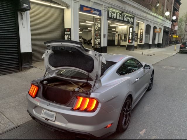 fred ashmore's cannonball record breaking mustang outside the red ball garage in new york city