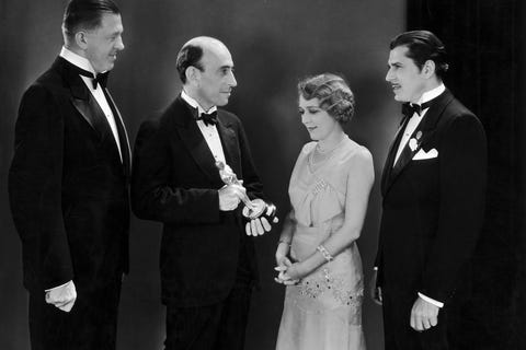Mary Pickford, Warner Baxter And Hans Kraly Receiving An Oscar 1929