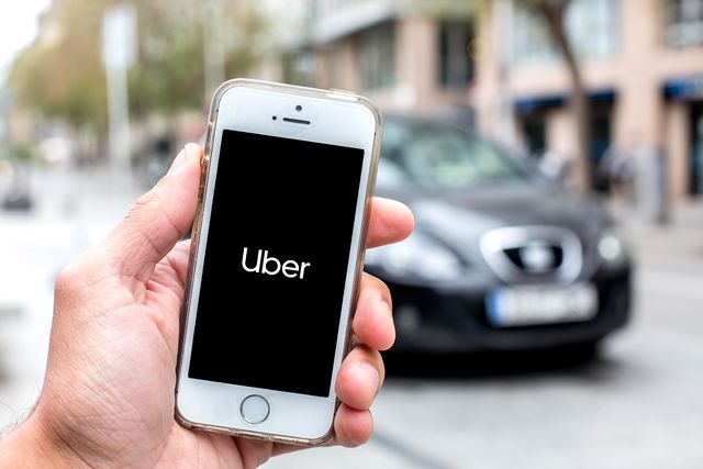 in this photo illustration a uber logo seen displayed
