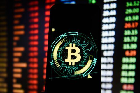 bitcoin logo is seen on an android mobile phone