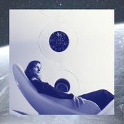 This is an image woman in virgin galactic space ship seat