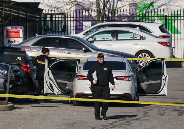 crime scene investigators walk through the parking lot of the mass shooting site at a fedex facility in indianapolis, indiana, on april 16, 2021   a gunman has killed at least eight people at the facility before turning the gun on himself in the latest in a string of mass shootings in the country, authorities said the incident came a week after president joe biden branded us gun violence an "epidemic" and an "international embarrassment" as he waded into the tense debate over gun control, a powerful political issue in the us photo by jeff dean  afp photo by jeff deanafp via getty images