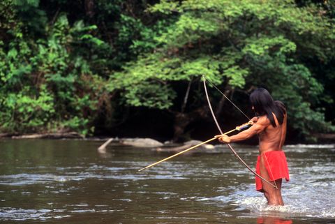 Indigenous Man Hunting in Amazon