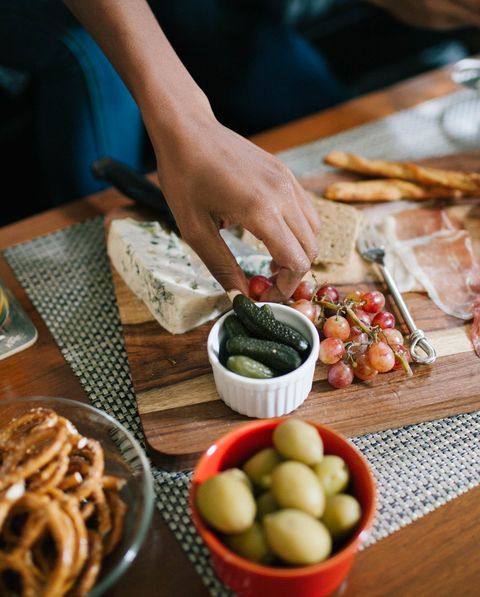 indulging in a charcuterie at a house party