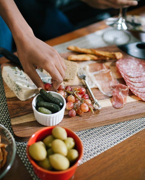 indulging in a charcuterie at a house party