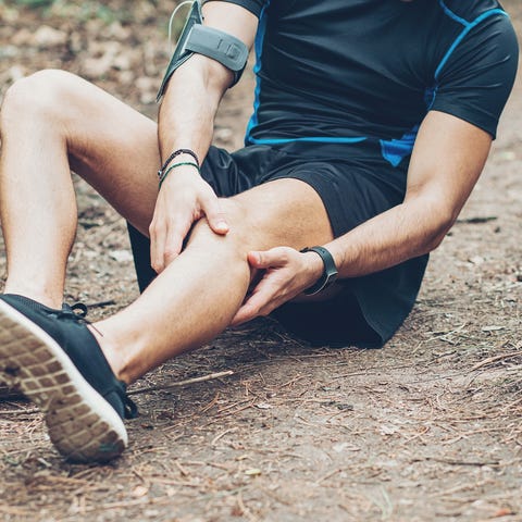 Injured athlete sitting on the ground