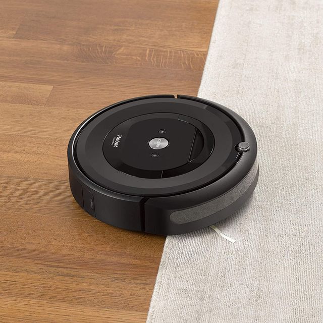 irobot roomba e5 5150 robot vacuum on wood floor and carpet