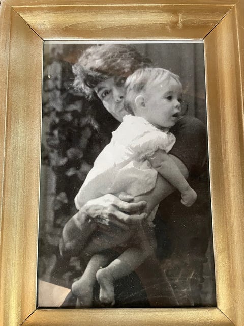 sara gonzález holds her small child isabel