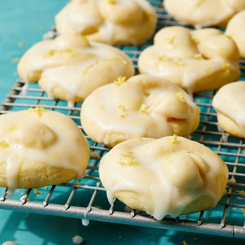 Italian lemon cookies covered with white icing and lemon zest