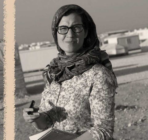 Lauren Wolfe holds a notepad while working as a journalist in the Zaatari refugee camp in Jordan. lauren wolfe holds a notepad while working as a journalist in the zaatari refugee camp in jordan