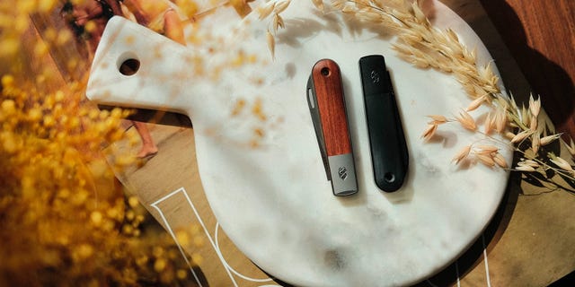two knives on a stone serving board