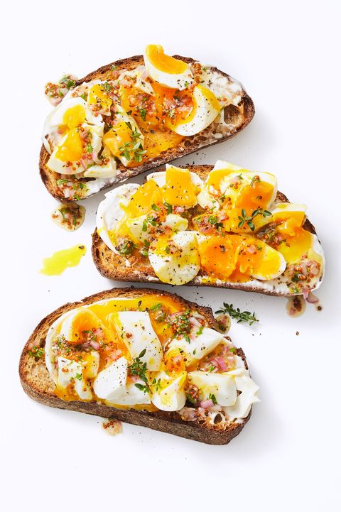 jammy egg toasts with fresh herbs on top