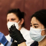 Covid Cases Continues To Surge In Michigan detroit, mi april 12 a pharmacist volunteer prepares doses of the johnson and johnson covid 19 vaccine during a pop up clinic at western international high school on april 12, 2021 in detroit, michigan the state of michigan has seen an explosion of covid 19 cases despite a massive effort to roll out vaccines pop up clinics in various communities are one of the ways the state government is trying to get the surge under control photo by matthew hatchergetty images