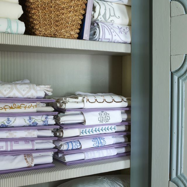 a closet in the bedroom’ entry vestibule holds hodges largest cache of exquisitely organized bedding and after a good ironing a matching flat sheet and pillow sham are folded to display their embroidery then tied to a linen board