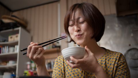 Japanese woman eating rice