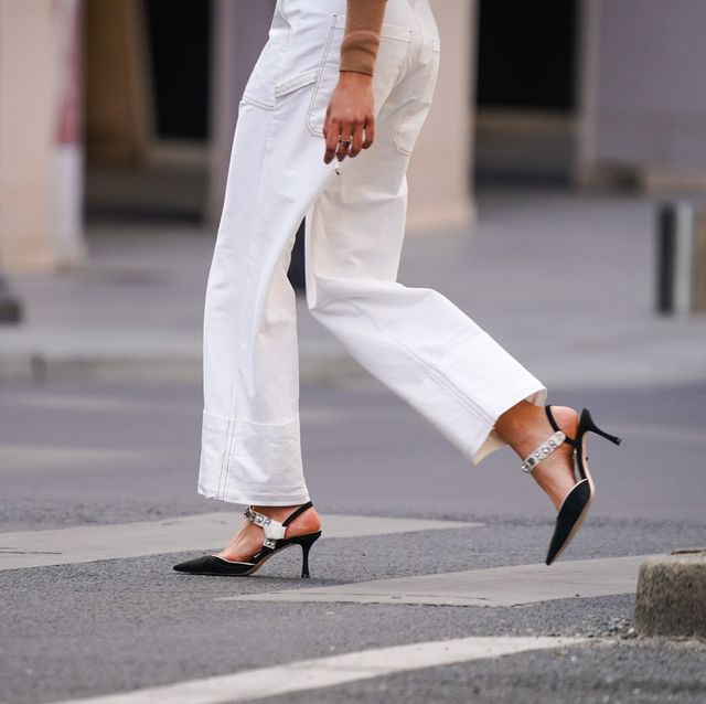 paris, france   may 14 a passerby wears white jeans, bejeweled pointy shoes, in the streets of paris, on may 14, 2020 in paris, france photo by edward berthelotgetty images