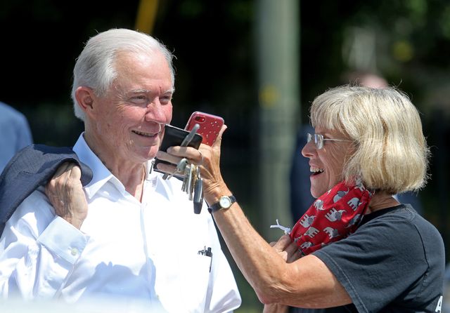 mobile, al   july 14 jeff sessions talks to a supporter on a phone held by kay rehm in the parking lot after sessions voted in the alabama republican primary runoff for the us senate at the volunteers of america southeast chapter on july 14, 2020 in mobile, alabama sessions is trying to reclaim his senate seat as he battles former auburn university coach tommy tuberville who has the support of president donald trump trump fired sessions shortly after the 2018 midterm elections and has been critical of his former attorney general during the runoff photo by michael demockergetty images