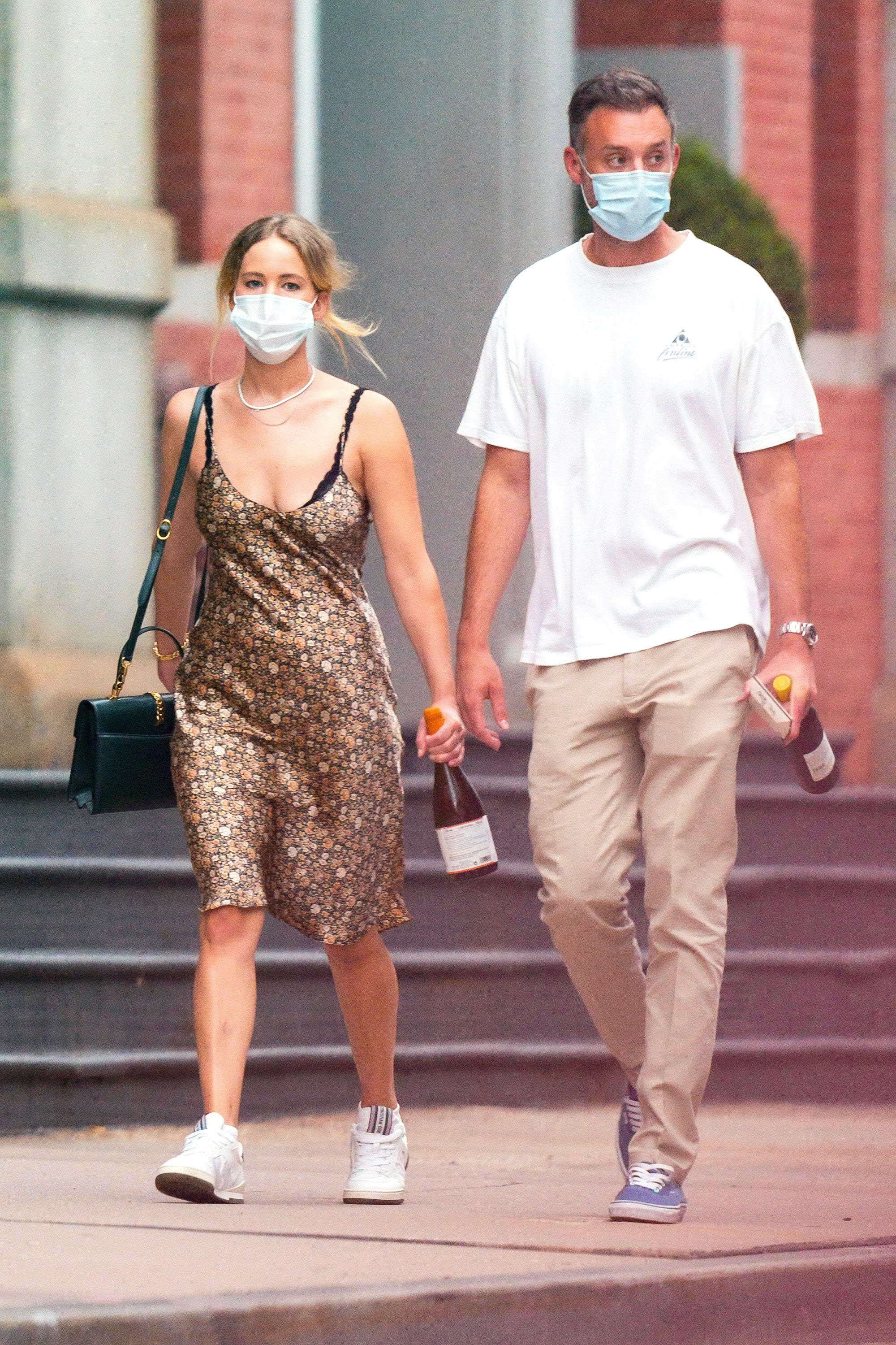 Jennifer Lawrence Wearing a Summer Dress, Mask, and Toting a Bottle of Wine Is a Whole COVID-19 Mood