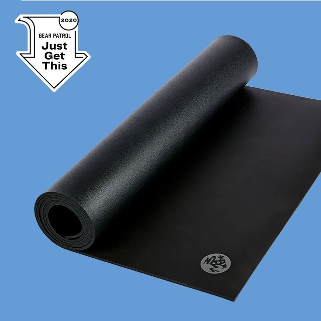 a black yoga mat on a blue background