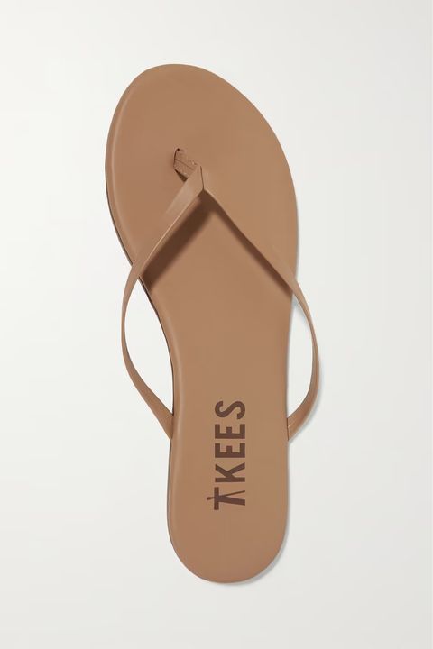 tkees slippers in sand