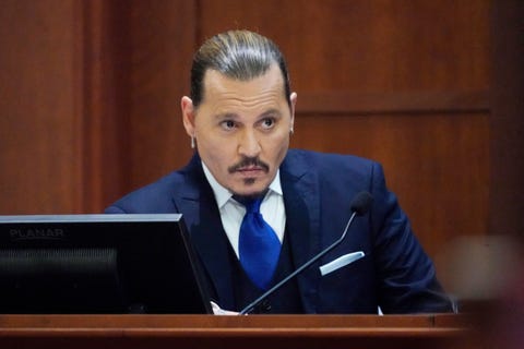 actor johnny depp sits to testify in the courtroom at the fairfax county circuit courthouse in fairfax, virginia, april 25, 2022 actor johnny depp sued his ex wife amber heard for libel in fairfax county circuit court after she wrote an op ed piece in the washington post in 2018 referring to herself as a 