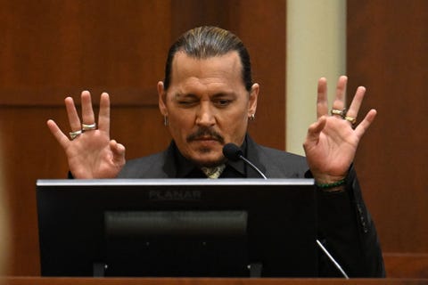 us actor johnny depp testifies during his defamation trial in the fairfax county circuit courthouse in fairfax, virginia, on april 19, 2022 depp is suing ex wife amber heard for libel after she wrote an op ed piece in the washington post in 2018 referring to herself as a public figure representing domestic abuse photo by jim watson pool afp photo by jim watson pool afp via getty images