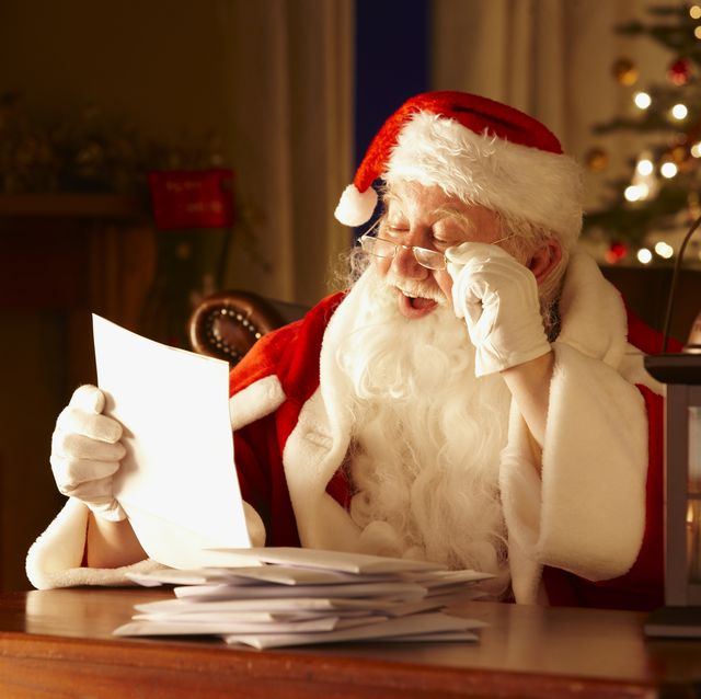 jolly father christmas reading letters from children