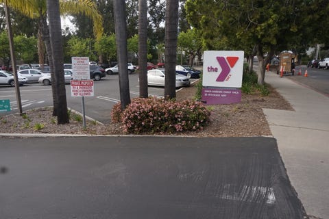 Asphalt, Public space, Lane, Road, Road surface, Sidewalk, Tree, Street, Sign, Infrastructure, 