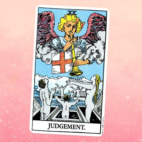 the judgment card for the tarot, showing an angel blowing a trumpet and naked people emerging from their graves