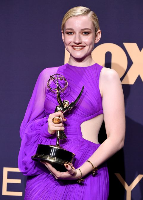 Julia Garner in a purple dress with her 2019 Emmy Award for Best Supporting Actress