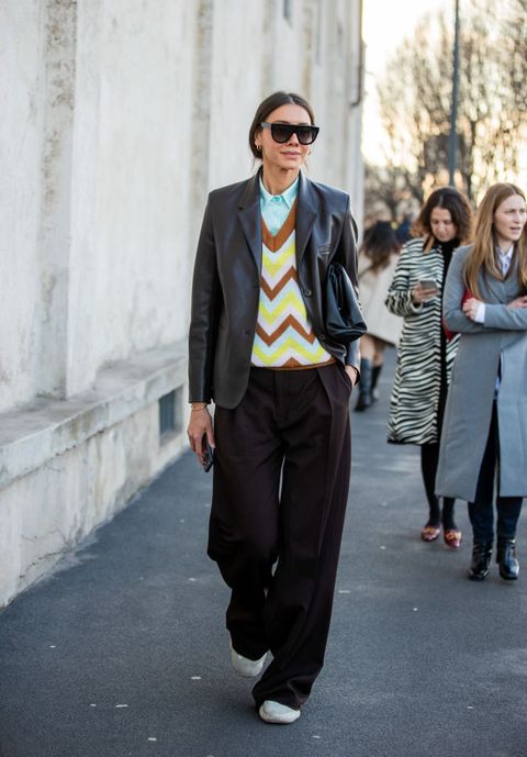 milan, italy   february 20 julie pelipas is seen wearing black jacket, v neck jumper, brown wide leg pants outside prada during milan fashion week fallwinter 2020 2021 on february 20, 2020 in milan, italy photo by christian vieriggetty images