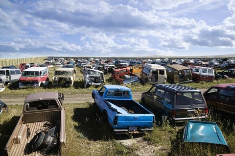 junk yard full of automobiles