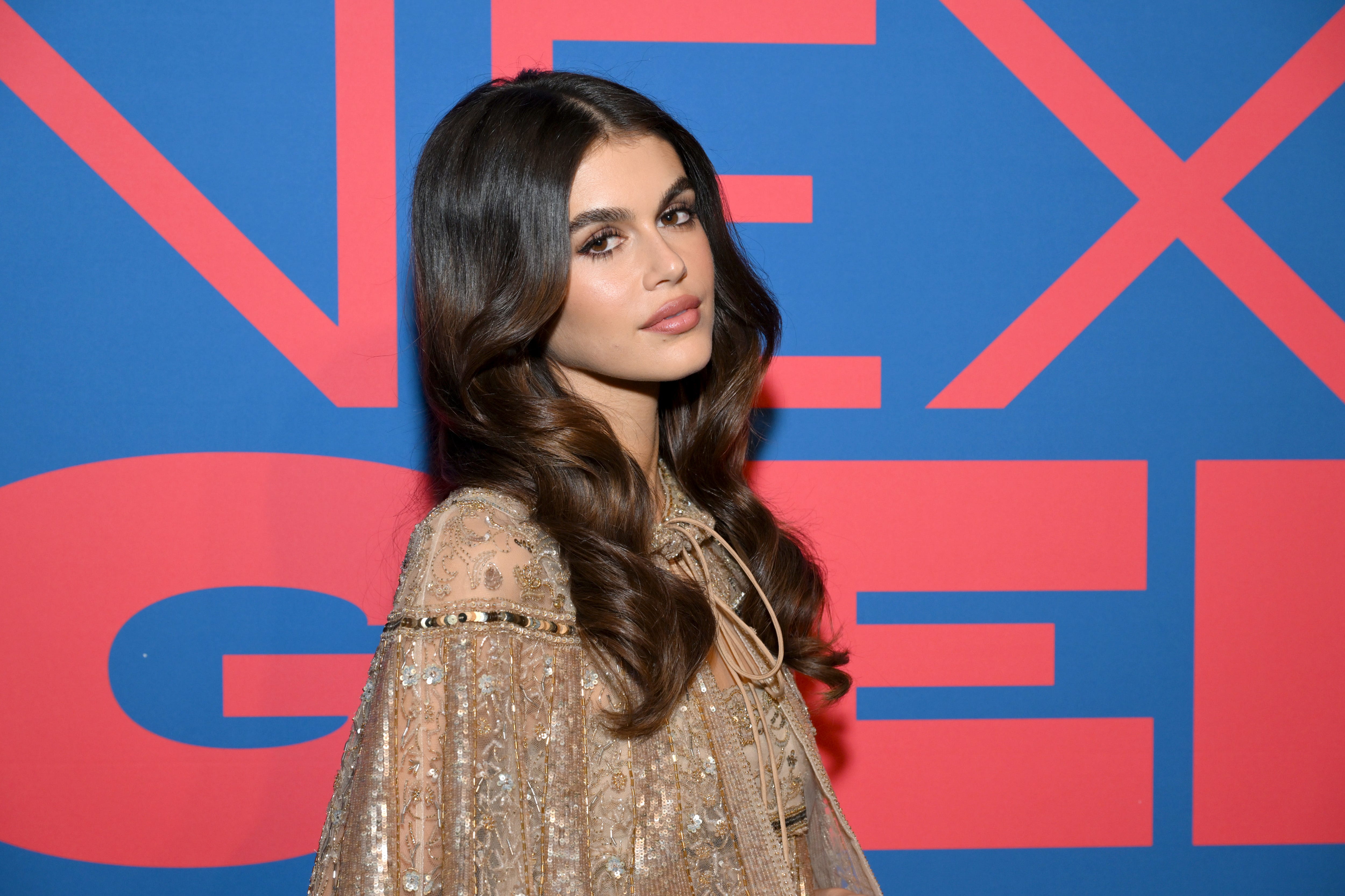 Kaia Gerber Looks Like a Schoolgirl Flapper in Frilly Gold Set