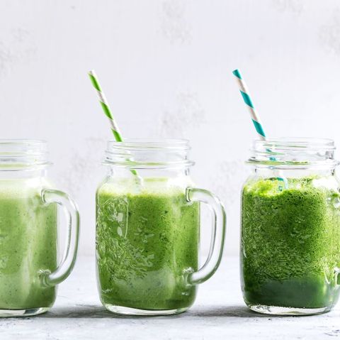 variety of three color green spinach kale apple yogurt smoothie in mason jars in row with retro cocktail tubes over gray background healthy vegan detox eating photo by natasha breenredacouniversal images group via getty images