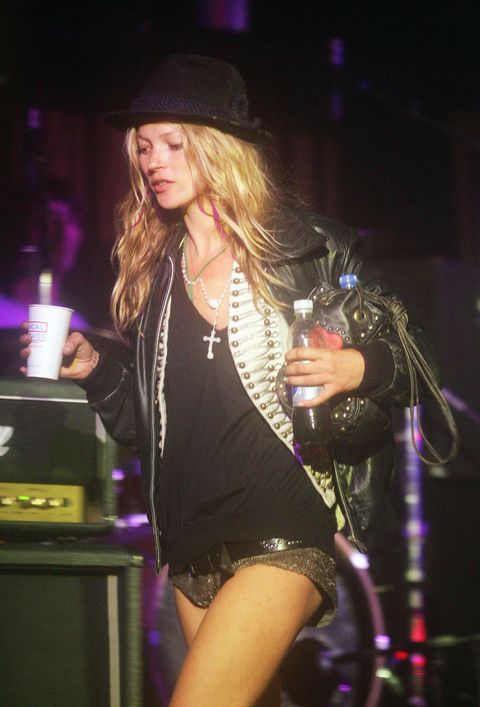 glastonbury, england   june 25 kate moss walks across the leftfield stage on her way to watch her boyfriend pete doherty and his band babyshambles perform, on the second day of the glastonbury music festival 2005 at worthy farm, pilton on june 25, 2005 in somerset, england the festival runs until june 26 photo by matt cardygetty images