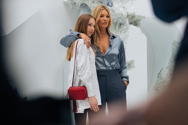 paris, france   june 21 supermodel kate moss and daughter lila moss  attend the dior men show during paris fashion week men's springsummer 2020 on june 21, 2019 in paris, france  lila wears a red ysl bag, white newsprint shirt kate wears a light blue silk blouse and blue pants photo by melodie jenggetty images
