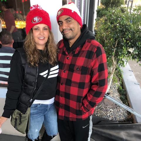 couple posing for a photo in san francisco sports gear