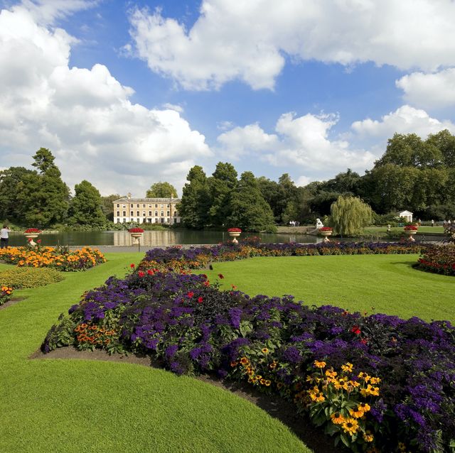 colourful flower beds in the beautifully maintained kew botanical gardens overlooking the lake, richmond upon thames, surrey, england