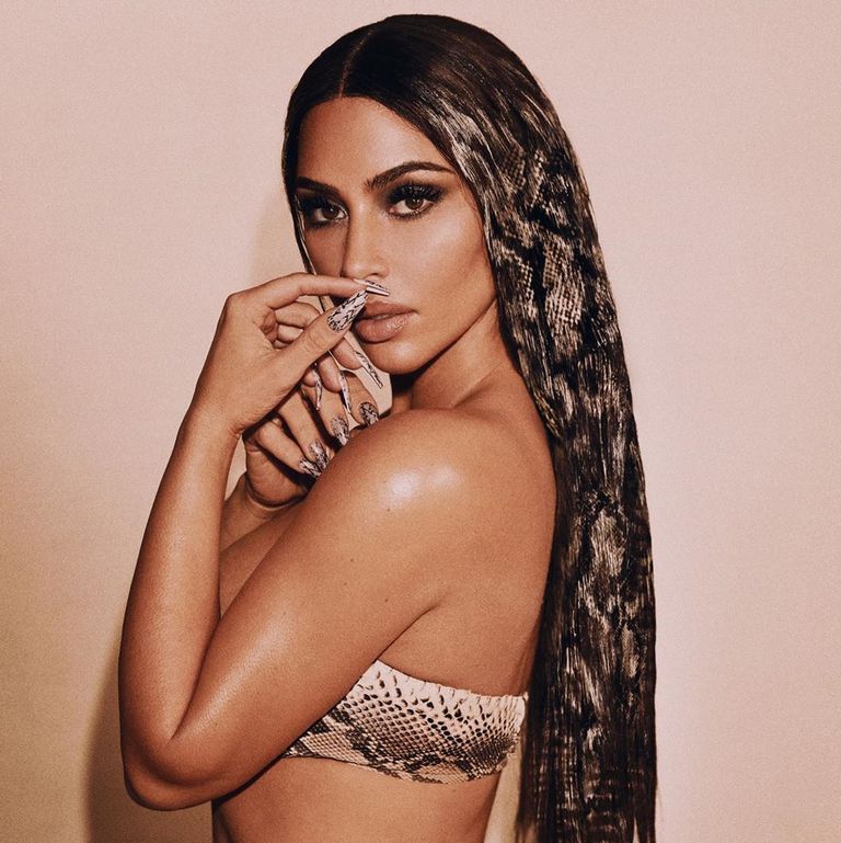 Kim Kardashian Has A Third Hand Coming Out Of Her Head In This Photoshop Fail